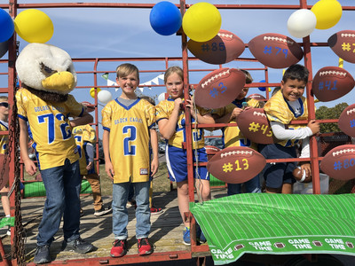 Youth Football players on a wagon during the 2024 Homecoming Parade.