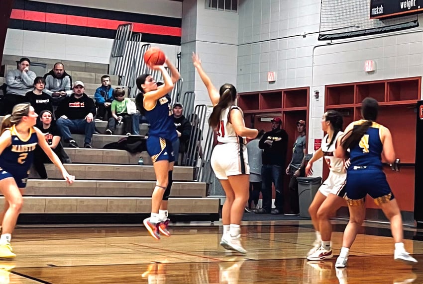 Basketball player pulls up for a shot.