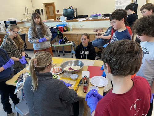 iLEAD learning to roll sushi as part of their culture advisory.