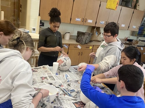 iLEAD creating pinatas as part of their culture advisory.