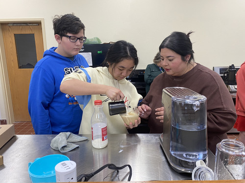 iLEAD students learn latte art through a demonstration.